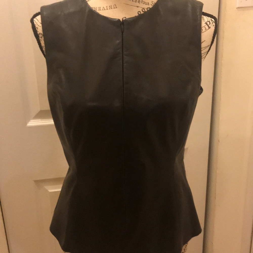 Leather front top with stretchy cotton back.
